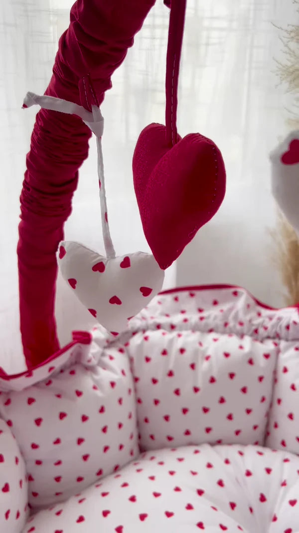 Cozy Baby Bassinet with Heart Print and Hanging Heart Mobiles