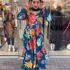 Navy Blue Floral Printed Anarkali Kurta Set with Matching Dupatta and Pants Featuring Vibrant Multicolor Blooms, Sequin Accents, and Stylish Yellow Heels for a Bold Festive Look