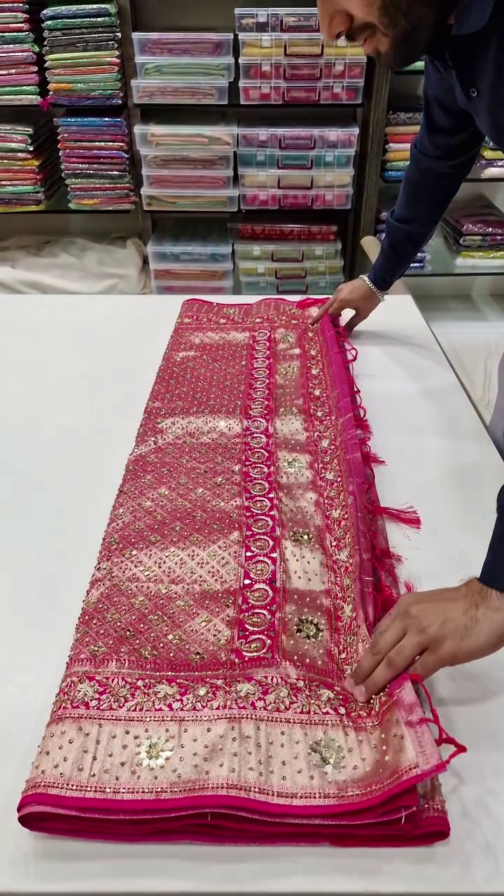 Designer Soft Net Pink Saree with Heavy Mirror Work, Intricate Embroidery, Stone Detailing, and Embellished Floral Borders with Tassel Pallu – Ideal for Wedding and Festive Occasions