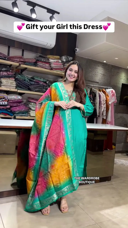 Green Anarkali Kurta Set with Colorful Bandhani-Style Dupatta, Delicate Neck Embroidery, and Flowy Silhouette – A Joyful Ethnic Gift Choice for Festive Celebrations and Special Moments