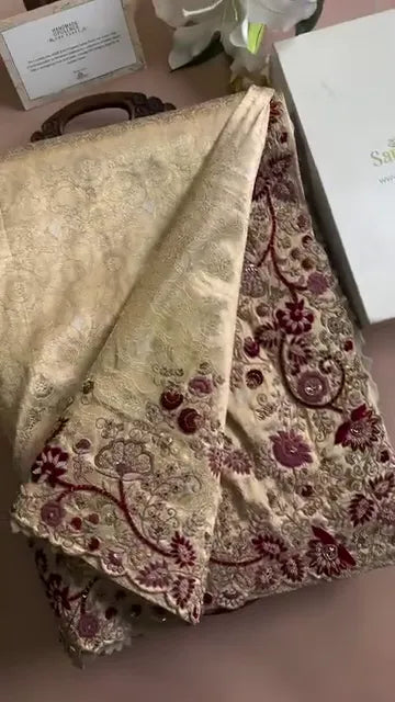 Elegant Maroon and Gold Embroidered Blouse with Intricate Floral Work, Paired with a Beige Embellished Skirt – Perfect for Festive Occasions